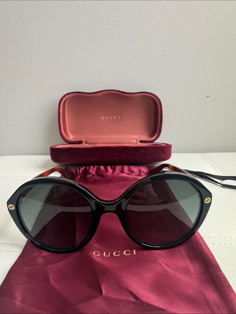 Gucci Black Oval Women's Sunglasses with Gold Logo Accents